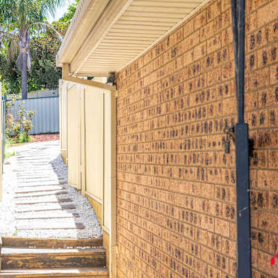 Convenient side pathway providing easy access around the property.