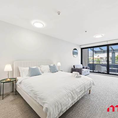 Bright bedroom with large windows