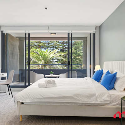 Bright bedroom with large windows