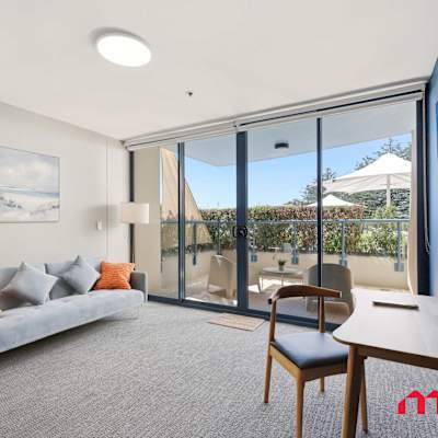 Living area with balcony and city view