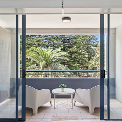 Balcony with seating and greenery view
