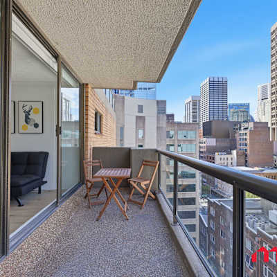 Balcony with city views and outdoor seating