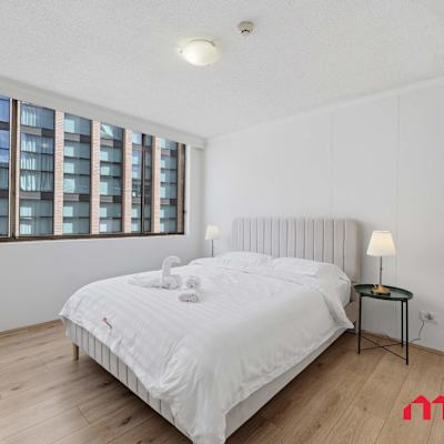 Bright bedroom with comfortable queen bed