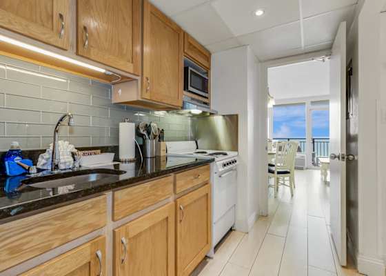 Whip up your favorite beach snacks in this charming, fully stocked kitchen—complete with ocean views just steps away. Who says you can't cook with a view?