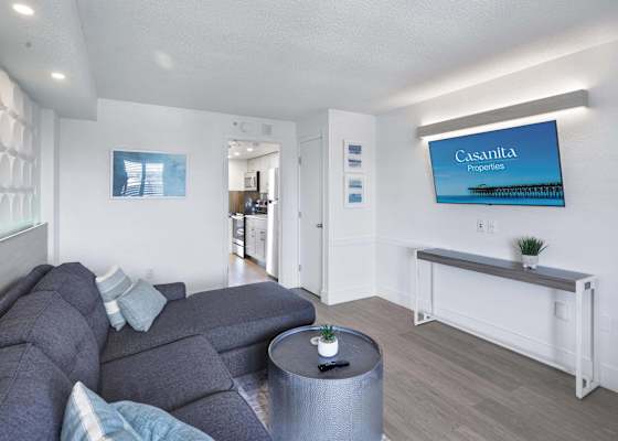 Relax and unwind in this spacious living area with comfortable seating and a large flat-screen TV