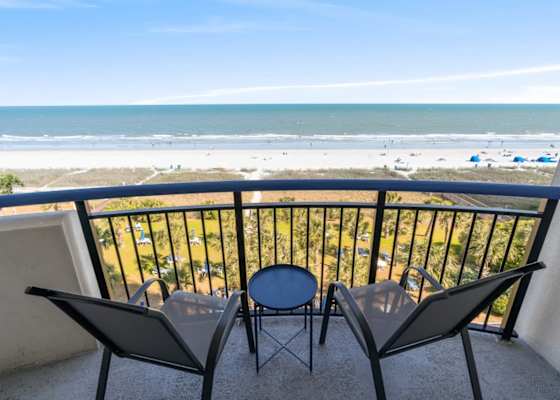 Sip your morning coffee or toast to sunset magic—this private balcony delivers front-row seats to the Atlantic with swaying palms below and salty breezes all around.