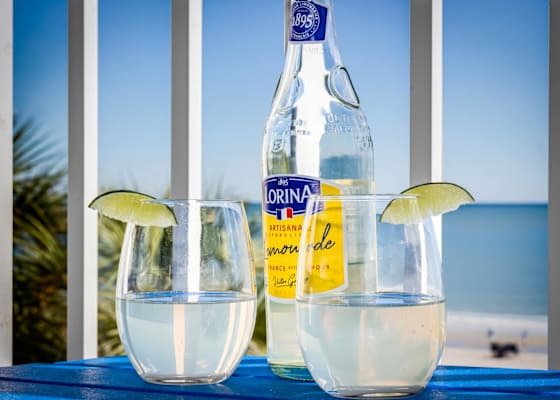 Cheers to ocean breezes and sparkling moments! Enjoy refreshing drinks on your private balcony while soaking in stunning beachfront views—your perfect recipe for relaxation and blissful vacation vibes.