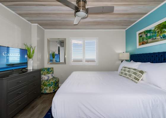 Retreat to this tranquil bedroom oasis, complete with a plush bed, modern furnishings, and soothing coastal decor. With its serene ambiance and touches of elegance, this space promises restful nights and refreshing mornings by the beach.