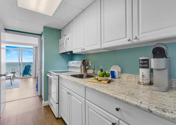 Prepare meals w/ a view in our fully-equipped kitchenette, complete w/ modern appliances & sleek granite countertops. Whether you're brewing morning coffee or fixing a quick snack, enjoy seamless access to a stunning  balcony for dining al fresco.