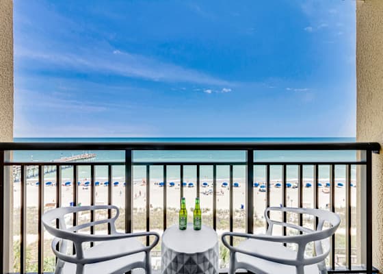 Enjoy stunning ocean views from your private balcony, complete with cozy seating to relax and take in the sights of the beach. Perfect for morning coffee or sunset evenings!