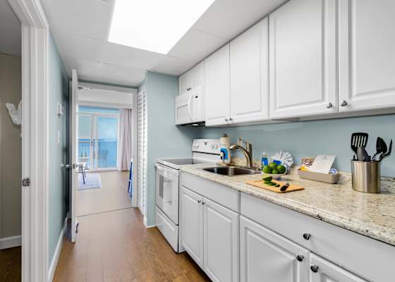 Cook up delicious meals in this fully equipped kitchen featuring granite countertops, modern appliances, and plenty of cabinet space. Whether it's a quick breakfast or a gourmet dinner, this space has everything you need!