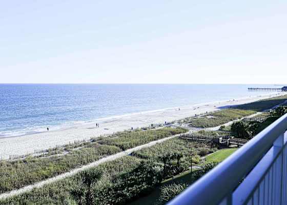 Front-row seat to paradise! Enjoy breathtaking ocean views from your private balcony—perfect for sunrise coffee or sunset wine. Just steps from the sand!