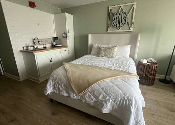 Cozy studio comfort featuring a plush queen bed