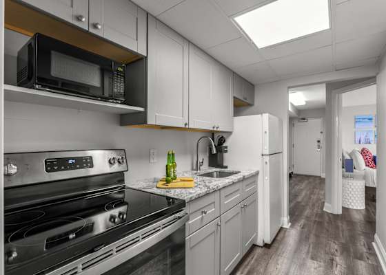 Fully-equipped kitchen with stainless steel appliances, perfect for cooking up a storm. 
