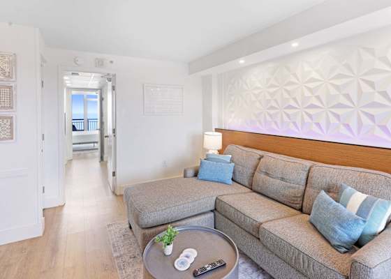 Unwind in style in our spacious living area, featuring LED mood lighting, plush seating, and a flat-screen TV for entertainment.