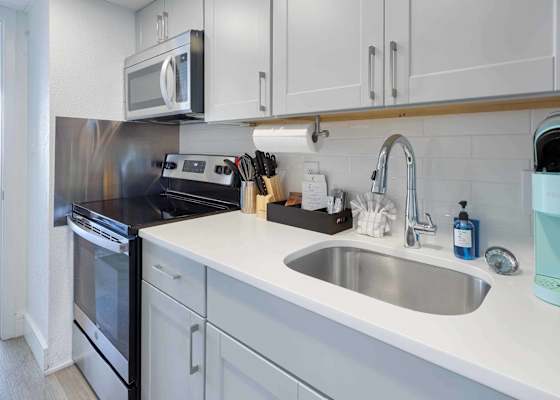Modern kitchen with stainless steel appliances, perfect for cooking up a storm. 