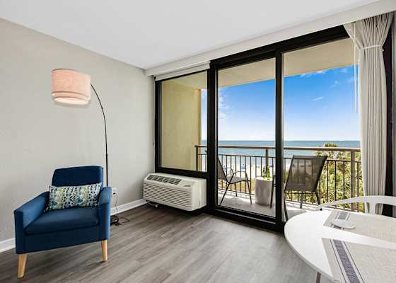 Whether you're streaming a movie or soaking up the ocean view, this bright and airy room offers comfort, entertainment, and coastal charm all in one relaxing space.