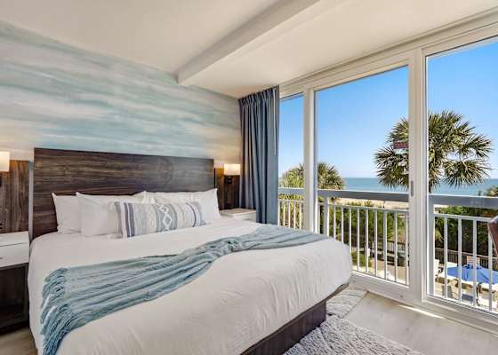 The master bedroom also features it's own Juliet balcony, with scenic oceanfront views.