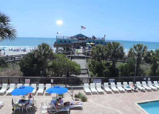 Wake up to breathtaking ocean views overlooking the iconic 14th Avenue Pier, with the sparkling pool deck and sandy shoreline just steps from your private Juliet balcony.