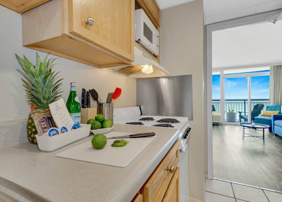 Cook with ease in this fully equipped kitchen featuring modern appliances, cookware, and essentials—perfect for preparing anything from quick beach snacks to family-style dinners with an ocean view.