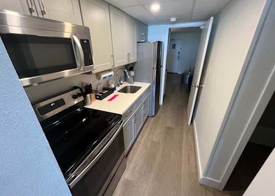 Enjoy the convenience of a fully equipped modern kitchen, complete with stainless steel appliances, sleek cabinetry, and all the essentials to prepare your favorite meals during your stay.