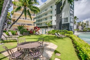 Spacious outdoor amenity area surrounded by greenery