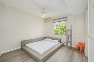 Clean and simple bed setup with natural light