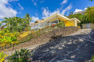 Tropical getaway with elevated views and vibrant garden landscaping