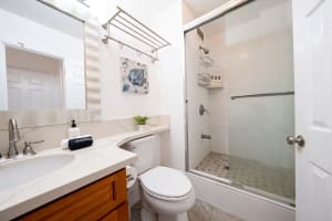 Guest-friendly full bathroom complete with enclosed shower