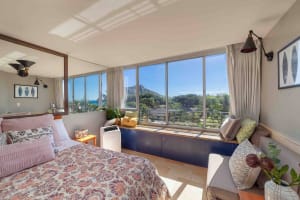 Charming bedroom with mountain views through the window