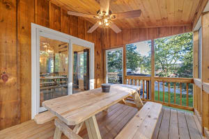 Bask in the beauty of nature while protected from pesky bugs in this serene screened porch.