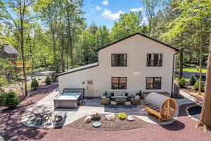 Elevate relaxation with our aerial view of the sauna and hot tub!