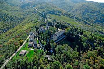 Aerial view of woods and an estate in Tuscany