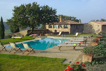 Swimming pool with deckchairs and sun beds