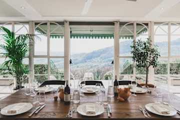 Plates and cutlery arranged on a dining table