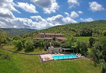 Aerial view of a house with pool in Tuscany