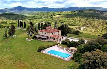Aerial view of a house with pool in Tuscany