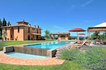 Long swimming pool next to lavender and grass
