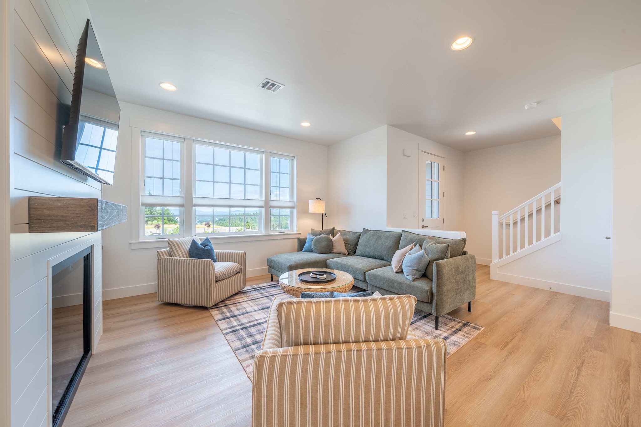 Light-filled living room with fireplace and open floor plan