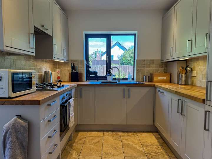 Cook up a storm in this fully-equipped kitchen, designed for both function and style.