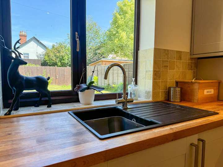 Where every meal begins—this kitchen with a sleek sink, ready for all your culinary creations.