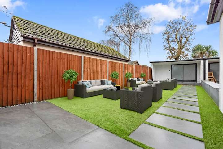 An outdoor sitting area with comfortable sofas.