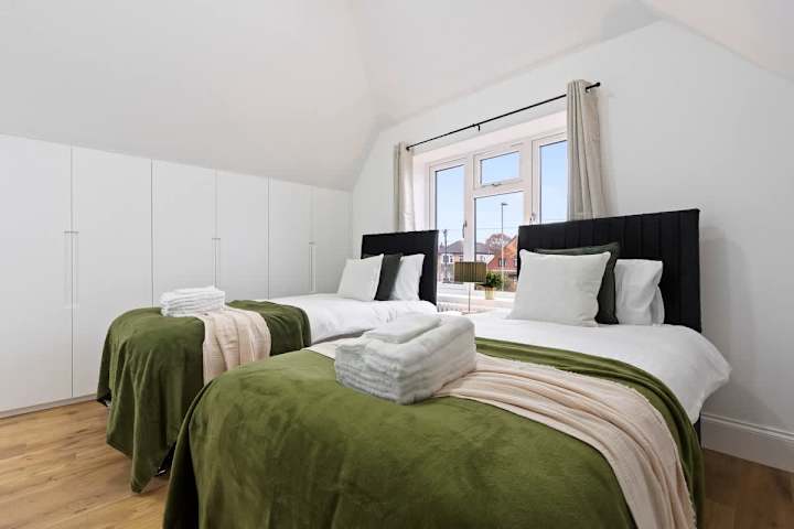 A comfortable twin room with 2 single beds with plenty of storage space