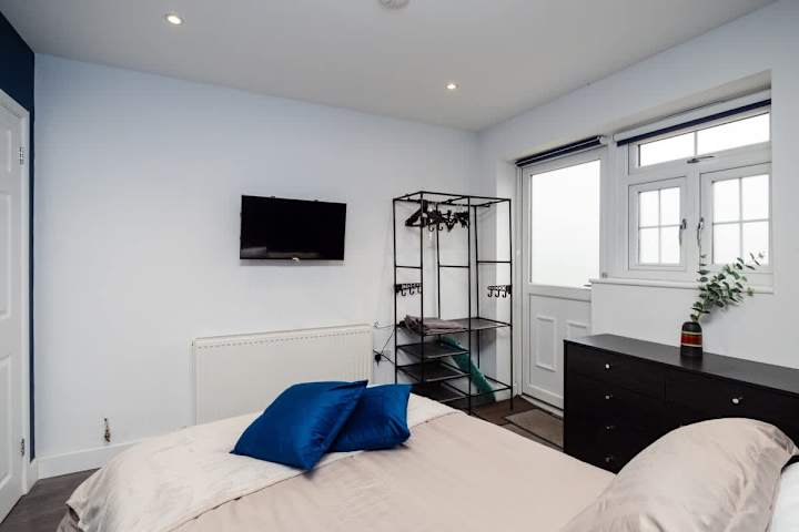 Bedroom with smart TV to watch your favourite movies before sleeping