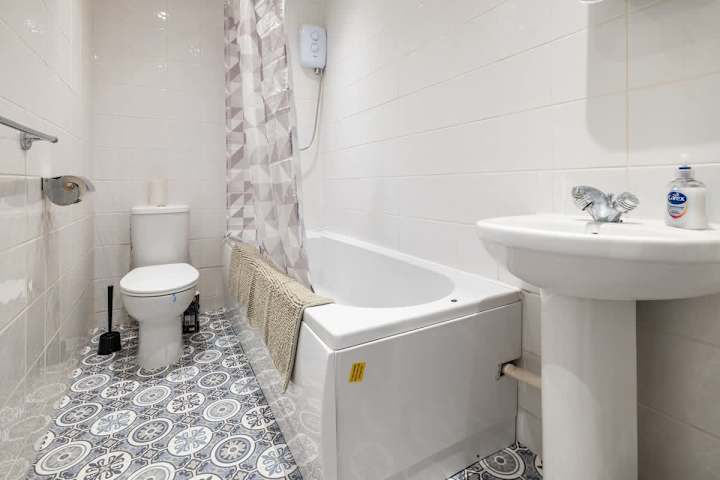 Fresh, simple, inviting toilet and bath