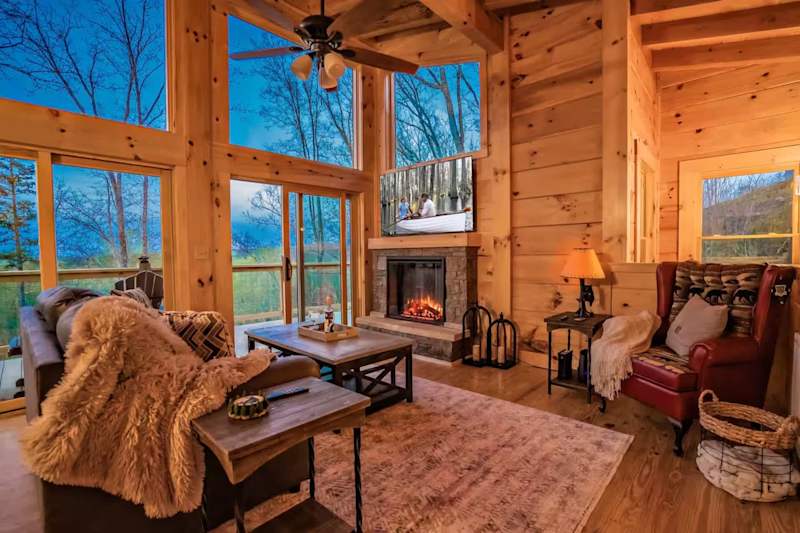 Tranquil Treat living room with tall windows and fireplace
