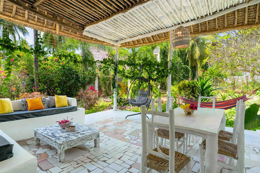 Leafy garden views from the veranda’s lounge and dining area.