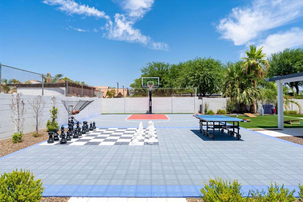 The Scottsdale Social — outdoor game court featuring a basketball hoop, giant chess board, and table tennis table
