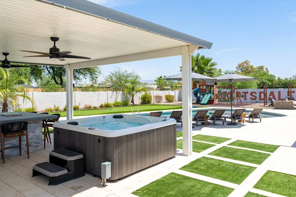 The Scottsdale Social — covered patio with a hot tub, outdoor bar, and swimming pool in the backyard