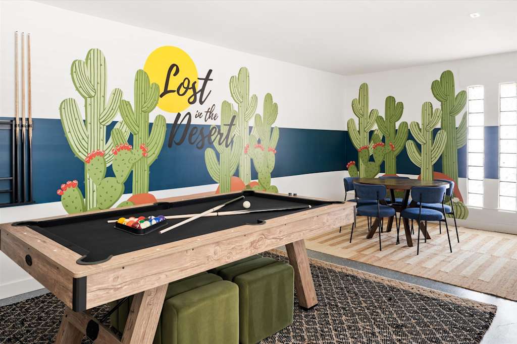The Scottsdale Social — game room featuring a pool table, cactus wall mural, and dining table with chairs